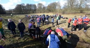 The teams gather at the start.
